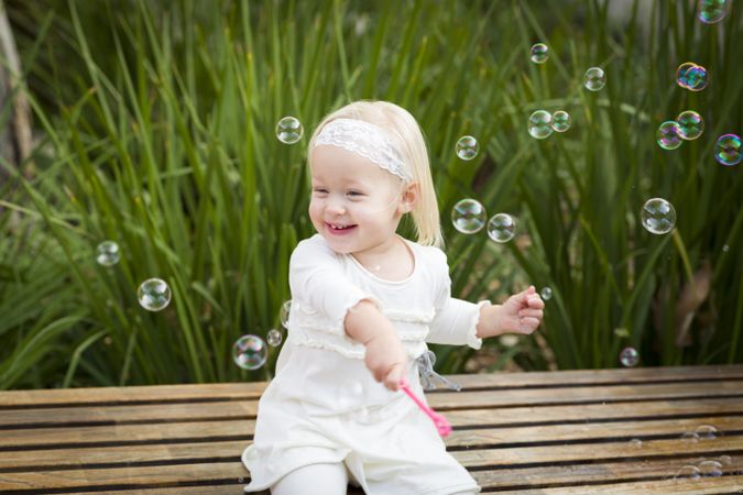 Adorable Little Girl Having Fun With Bubbles