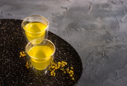 Two glasses of Italian digestif limoncello with garnish