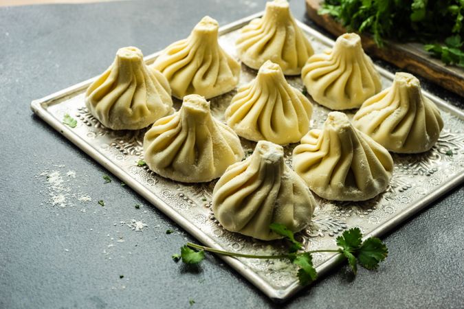 Trey of Georgian khinkali dumplings with cilantro