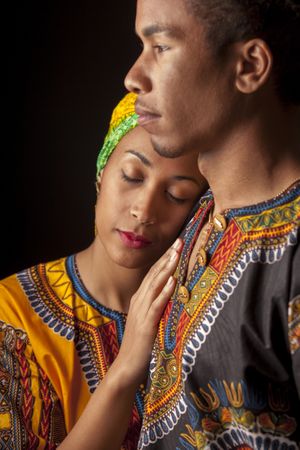 Woman with eyes closed clinging to man