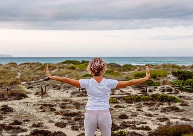 Adult woman practicing martial arts in nature
