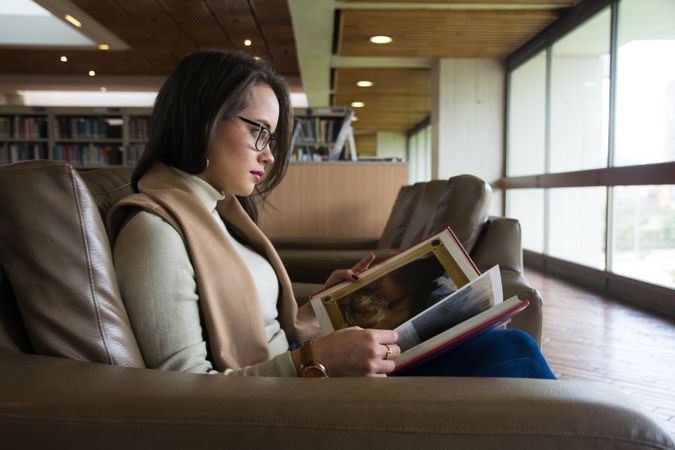 Woman in glasses reading a book