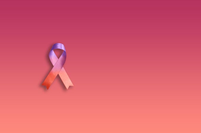 One pink ribbon on gradient pink background