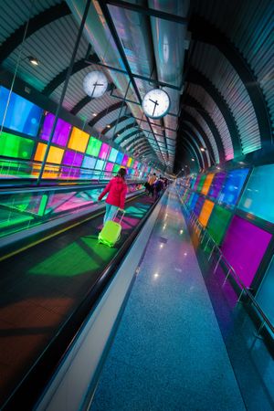 Woman standing on travelator in airport