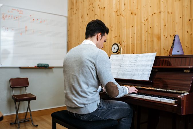 Man playing piano in studio