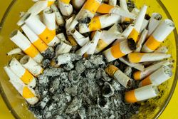 Top view of smoked cigarette in ash tray