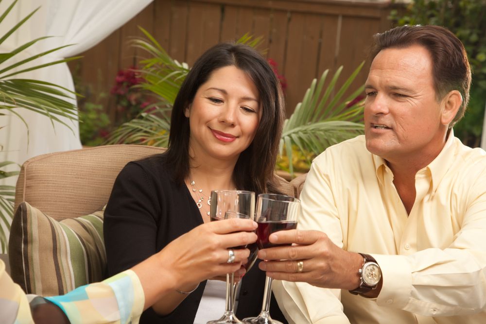 Three Friends Enjoying Wine on the Patio