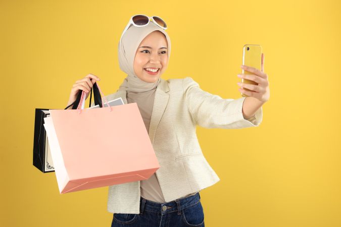Young Asian Woman Selfie While Showing Off Her Paper Bag