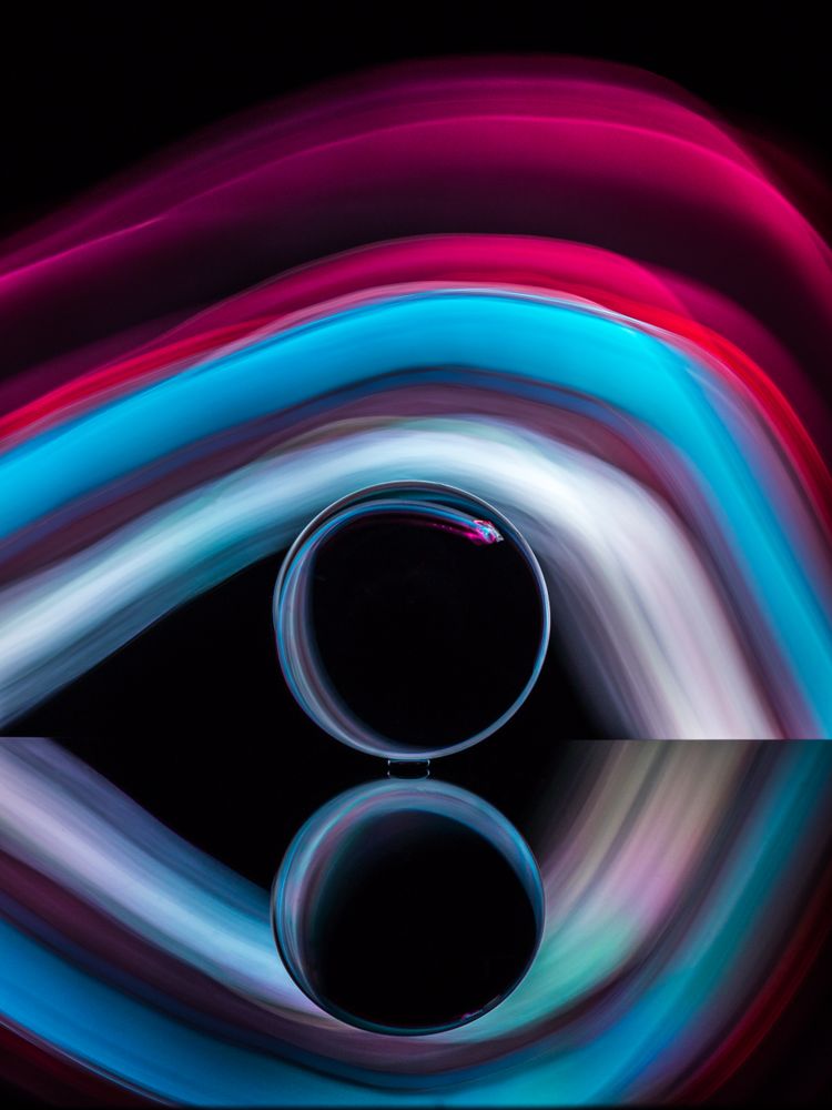 Crystal ball on board near abstract shines