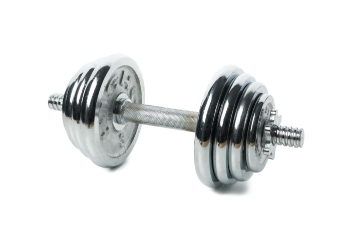 Dumbbell isolated on light background. Healthy lifestyle