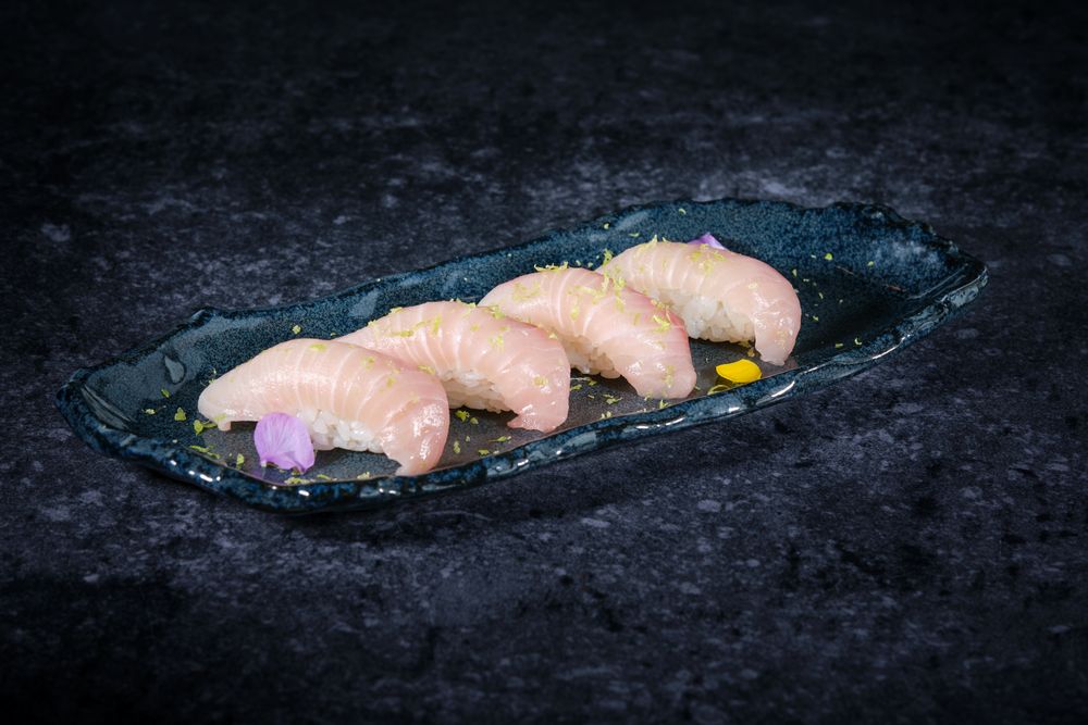 Sushi on fish and rice on ceramic plate