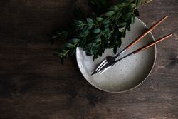Top view of spring table setting with fresh branch