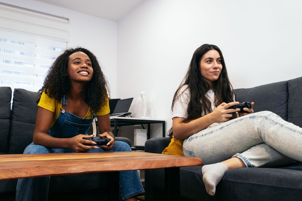 Friends bonding over console gaming in living room