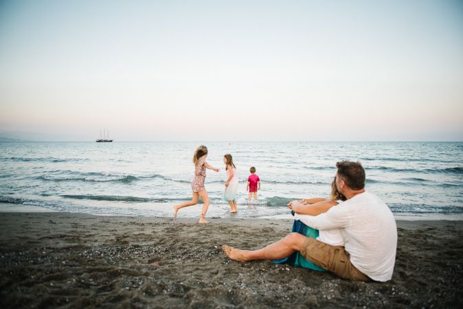Beautiful happy family with children on beach