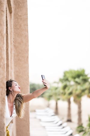 Woman making a selfie in balcony