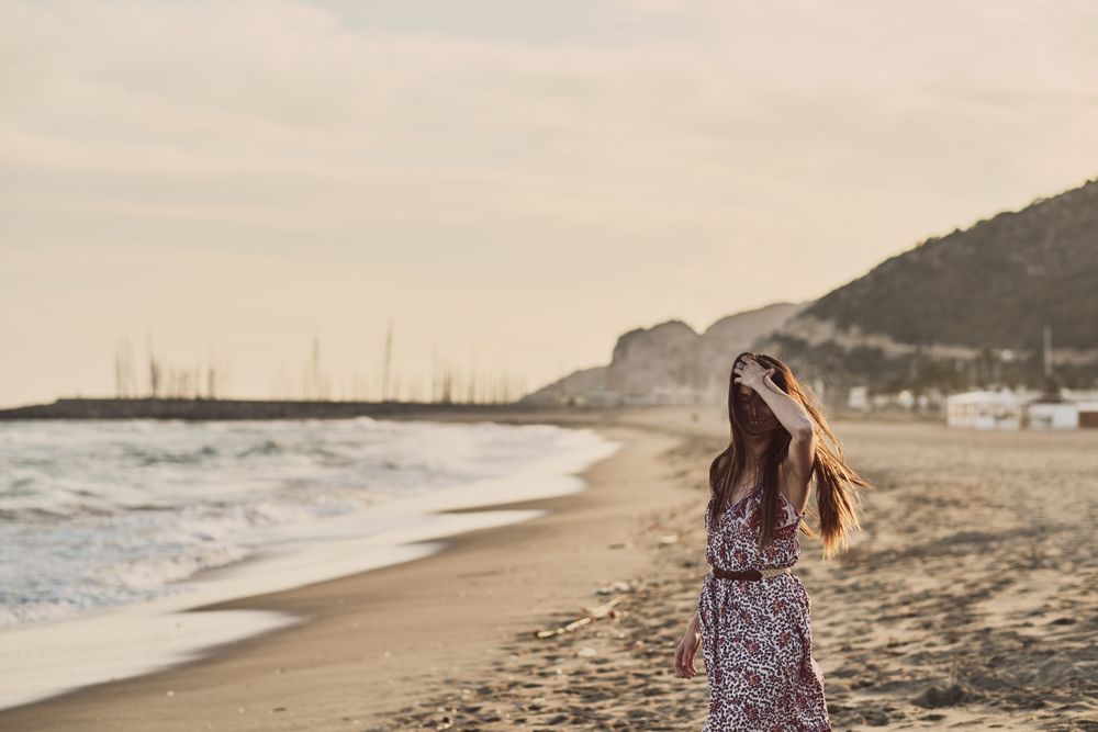 Woman with dress at the beach
