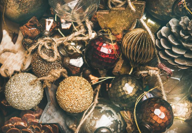 Rustic holiday tree decorations, pine cones, balls and baubles