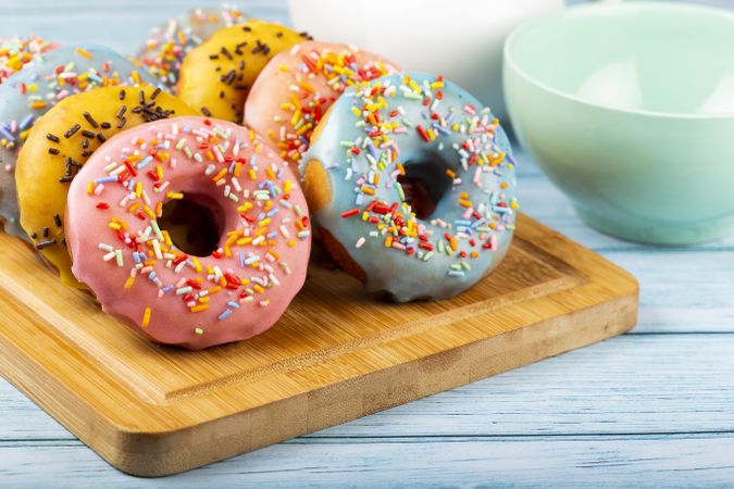 Delicious assorted colorful donuts on the table.