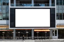 Large LED billboard mockup  on commercial building with restaurant underneath beJpq0