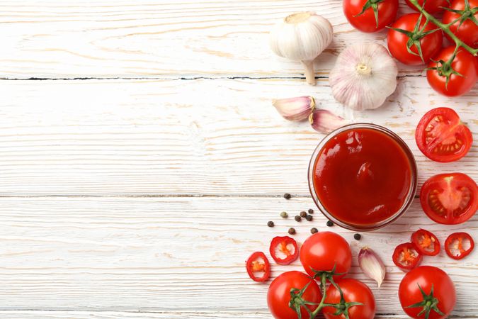 Composition with tomatoes on wooden background, top view