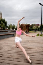 Unrecognizable ballet dancer in city street