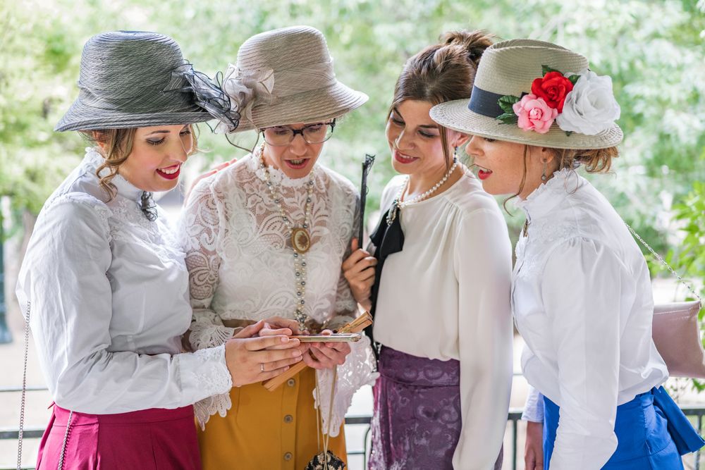 Vintage women using smartphone in garden