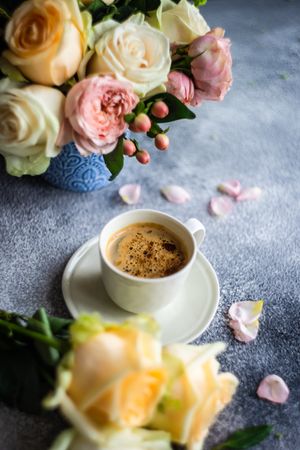 Yellow & pink roses with cup of coffee
