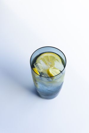 Water with lemon in tall glass