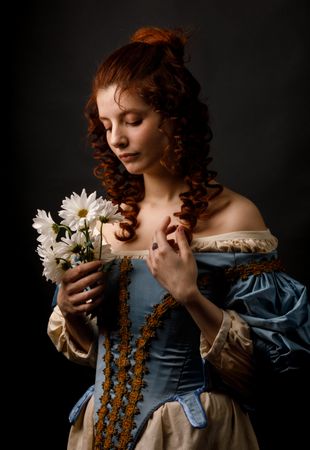 Baroque woman with closed eyes holding flowers