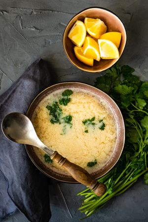Top view French onion cream soup served with lemon