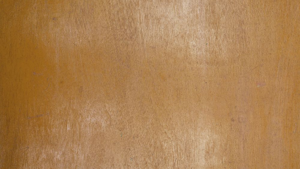 Polished light brown wooden surface with fine natural grain texture