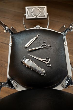 Professional barber tools on leather chair