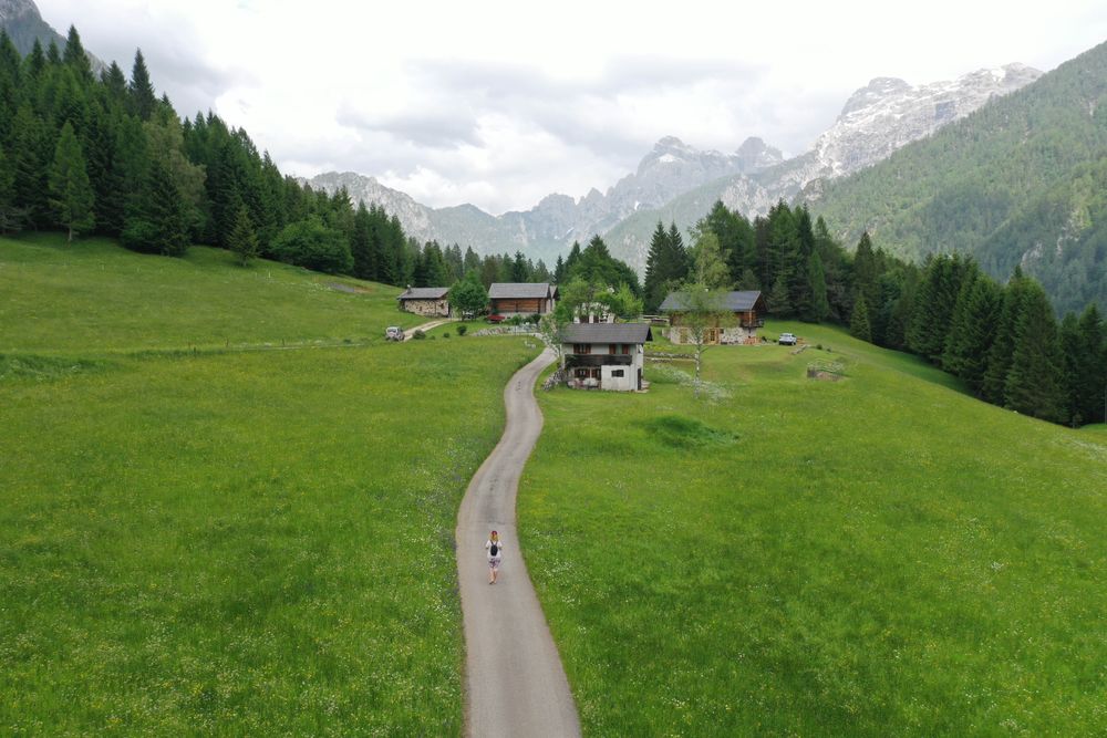Person walking on pathway to a village in Raron, Switzerland