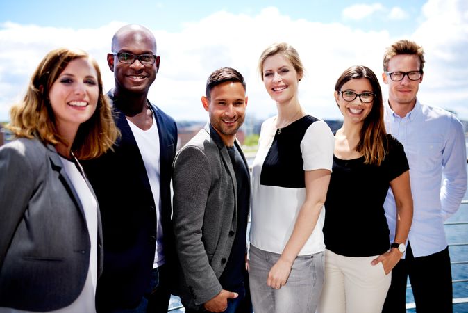 Business colleagues standing outside and smiling