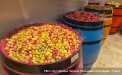 Colorful sweets in wooden barrels 0PwOmb