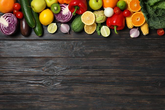 Different vegetables and fruits on wooden background, copy space