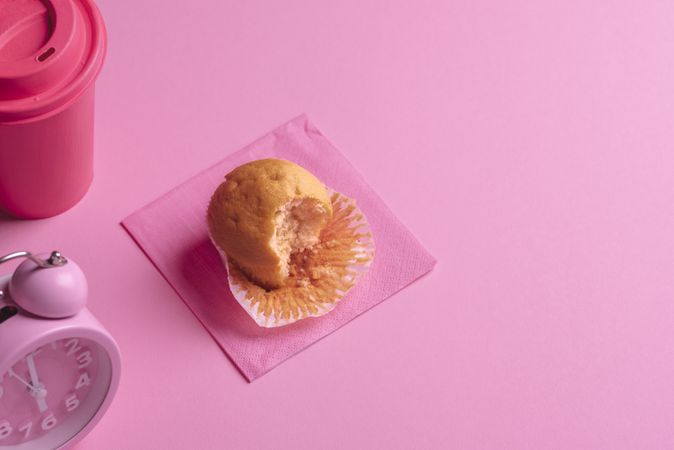 Eaten muffin on a pink napkin