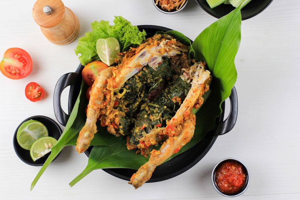 Ayam Betutu. Balinese Roast Chicken Stuffed with Cassava Leaves.