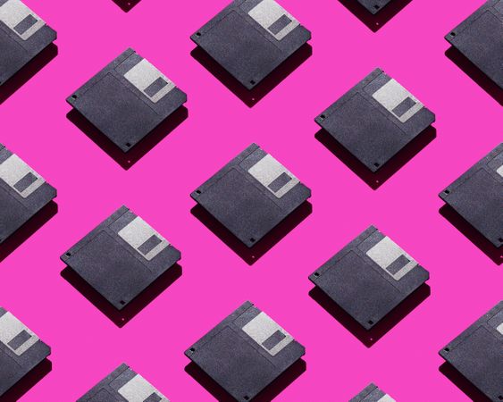Floppy disks over hot pink background