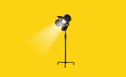 Single studio lampsover yellow background