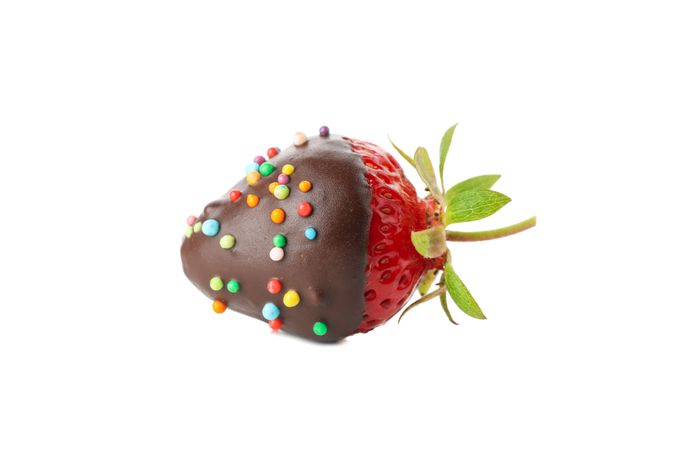 Chocolate fondue. Strawberry in chocolate isolated on plain background