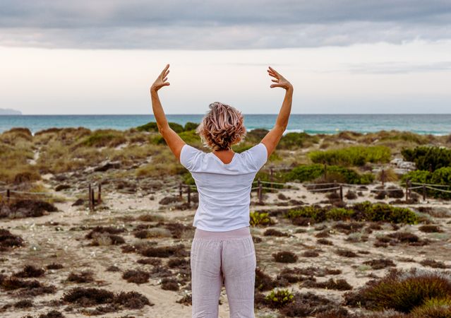 Adult woman practicing martial arts in nature