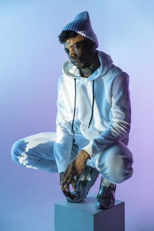Stylish Black man on cube