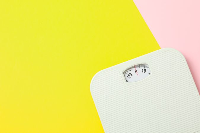 weigh scales on two tone background, space for text