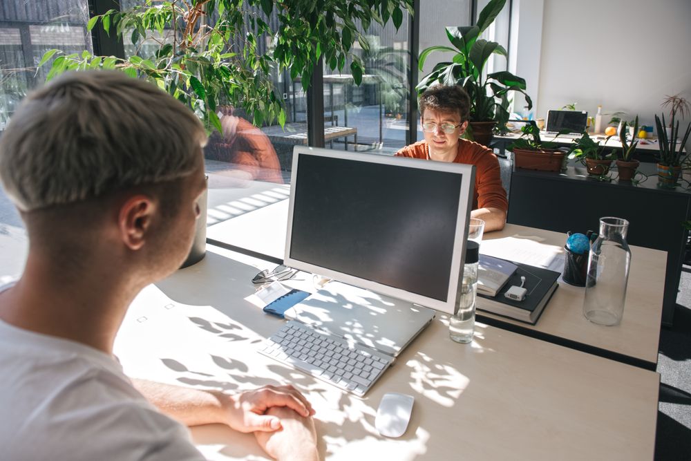 People working in sunny modern office