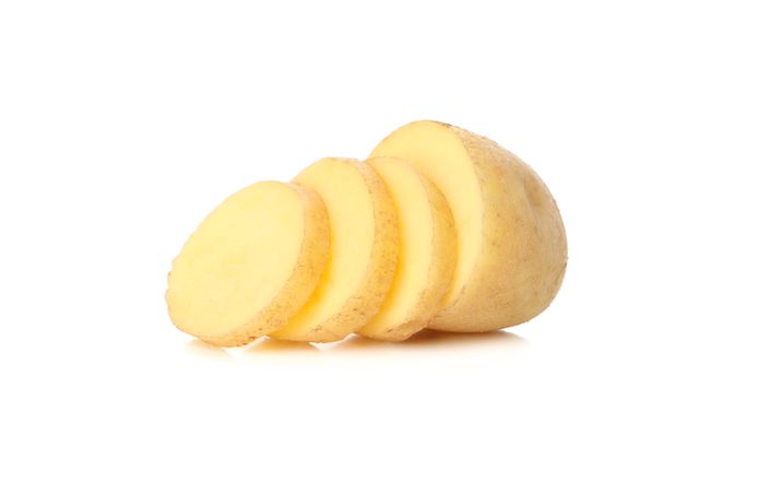 One sliced potato in bright room