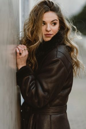 female standing on city street
