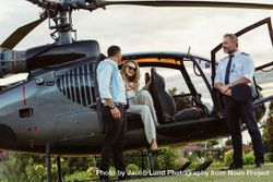 Couple traveling by a private helicopter 56GDJP