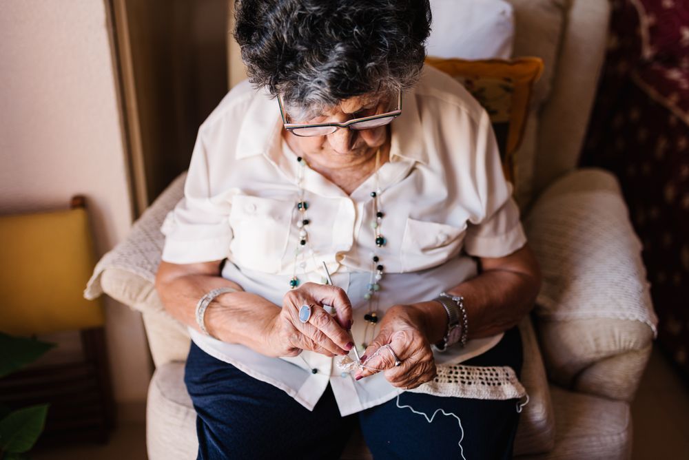 Older woman knitting crochet