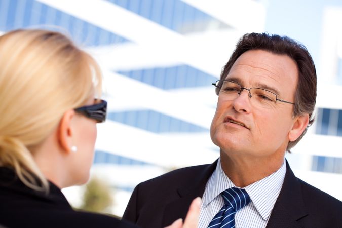 Businessman Talking with Female Colleague